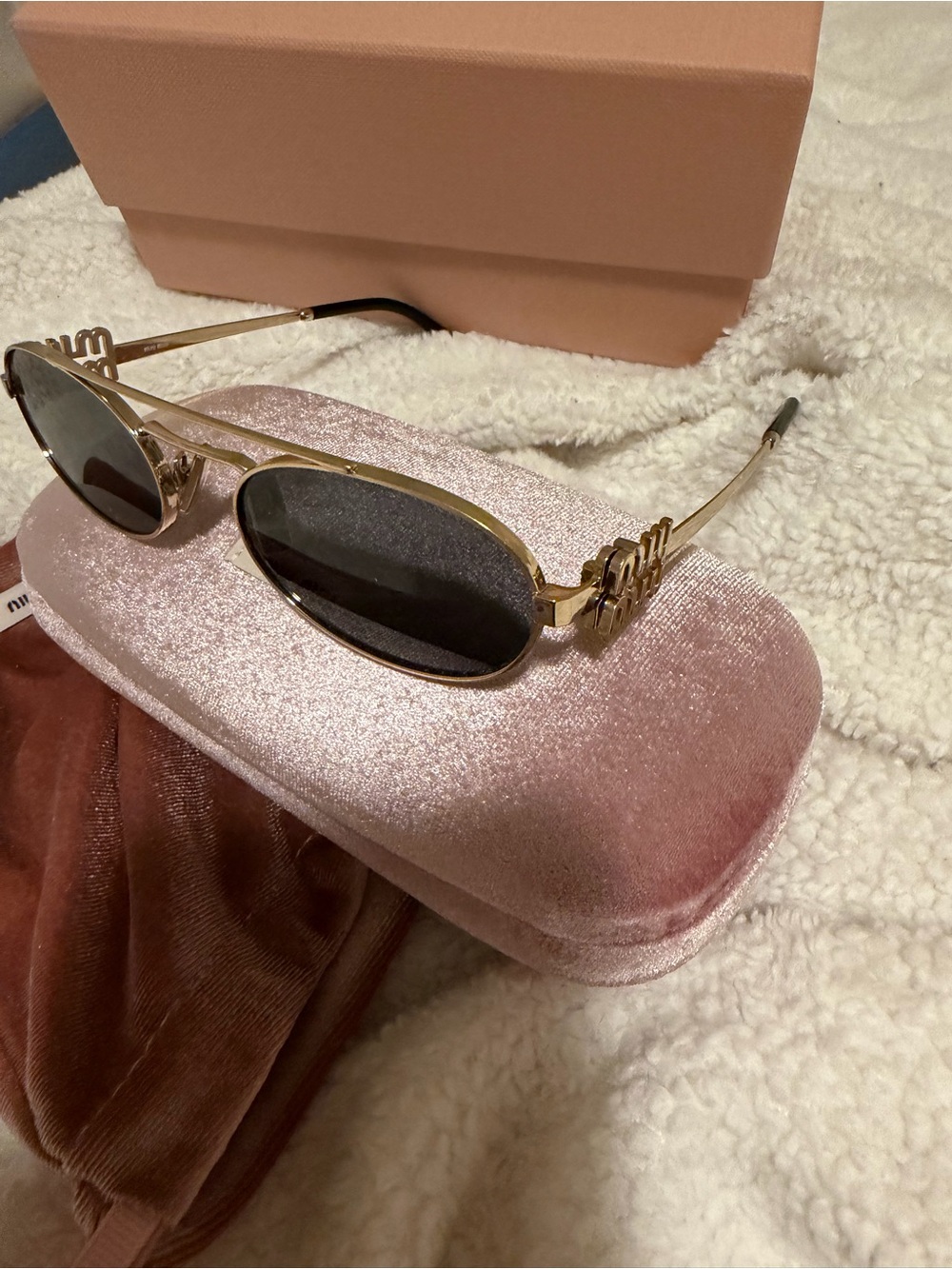 Miu Miu Gold Frame Sunglasses with Black Lenses
